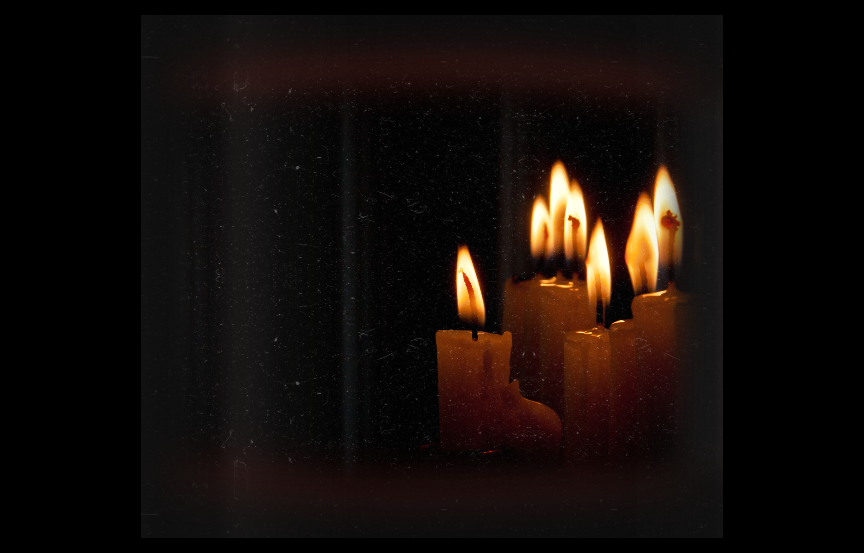 low-angle photo of lightened candles